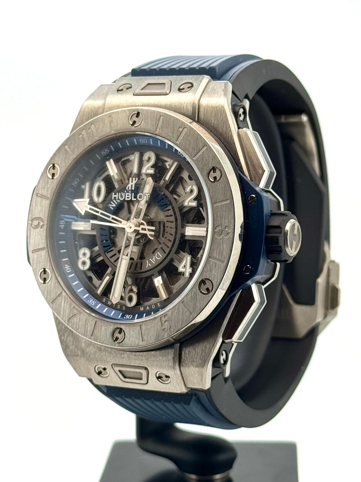 BIG BANG UNICO GMT 45MM TITANIUM BLUE GREY SKELETON DIAL (WATCH & PAPER)